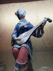 Chinese woman playing instrument