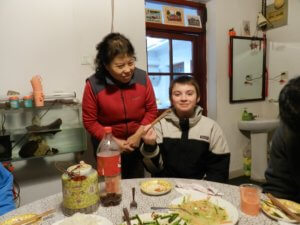 boy eating with chopsticks 