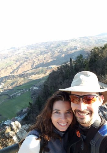 A couple poses on Monte Titano, San Marino.